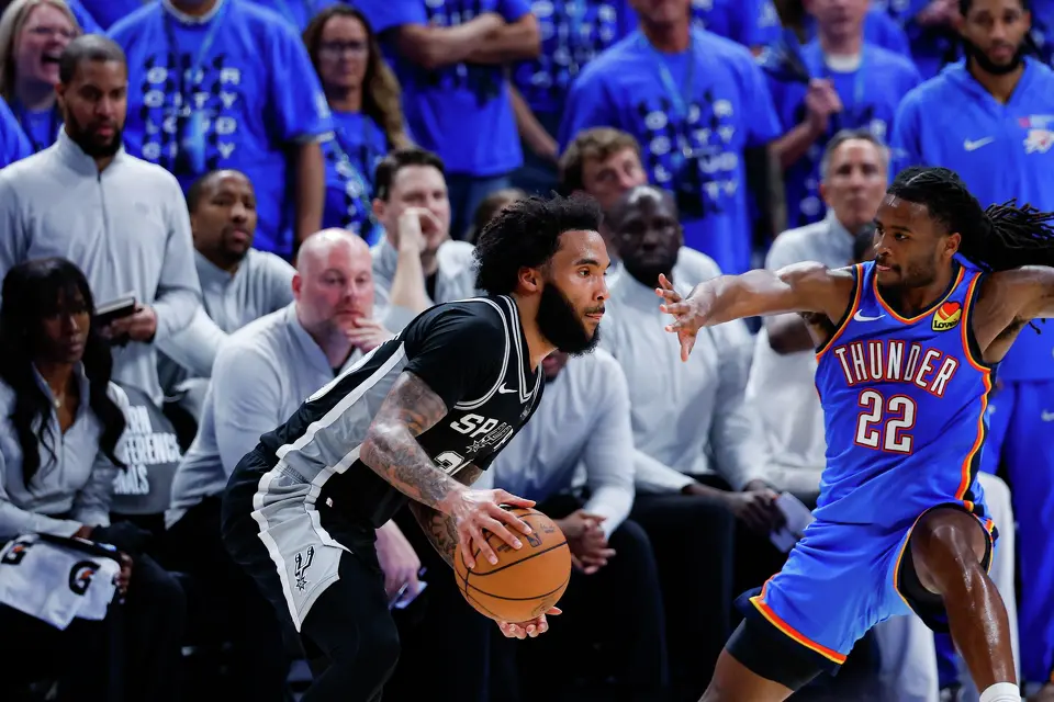 San Antonio Spurs forward Julian Champagnie (30) drives past Oklahoma City Thunder guard Cason Wallace (22) during the fourth quarter of Game 7 of the Western Conference Finals at Paycom Center in Oklahoma City, Saturday, May 30, 2026. The Spurs defeated the Thunder 111-103 to advance to the NBA Finals against the New York Knicks.