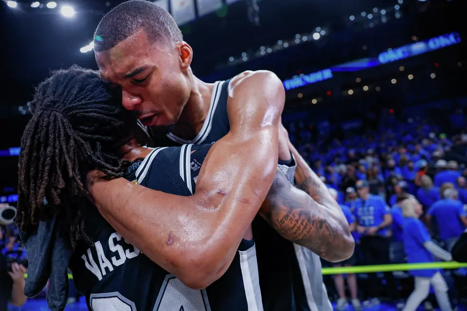 San Antonio Spurs center Victor Wembanyama (1) and guard Devin Vassell (24) embrace as they celebrate their Western Conference Finals win over the Oklahoma City Thunder at Paycom Center in Oklahoma City, Saturday, May 30, 2026. The Spurs defeated the Thunder 111-103 in Game 7 to advance to the NBA Finals against the New York Knicks.