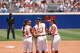 Texas pitcher Teagan Kavan, center, gathers with her infield during the Longhorns' game against Tennessee Thursday at Devon Park in Oklahoma City in the Women's College World Series.