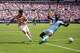 United States forward Christian Pulisic (10) shoots past Senegal forward Cherif Ndiaye (23) during the first half of an international friendly soccer match Sunday, May 31, 2026, in Charlotte, N.C.