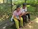 Siblings Saaradha Saravanan, 12, left, and Aadhavan Saravanan, 15, sit in a park in Petaling Jaya, near Kuala Lumpur Malaysia Monday, June 1, 2026.