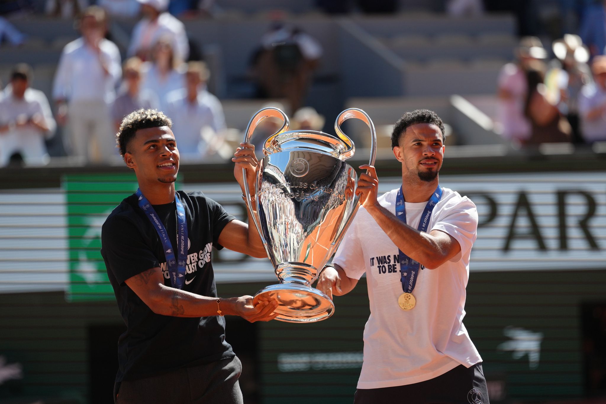 PSG stars bring the Champions League trophy to the French Open