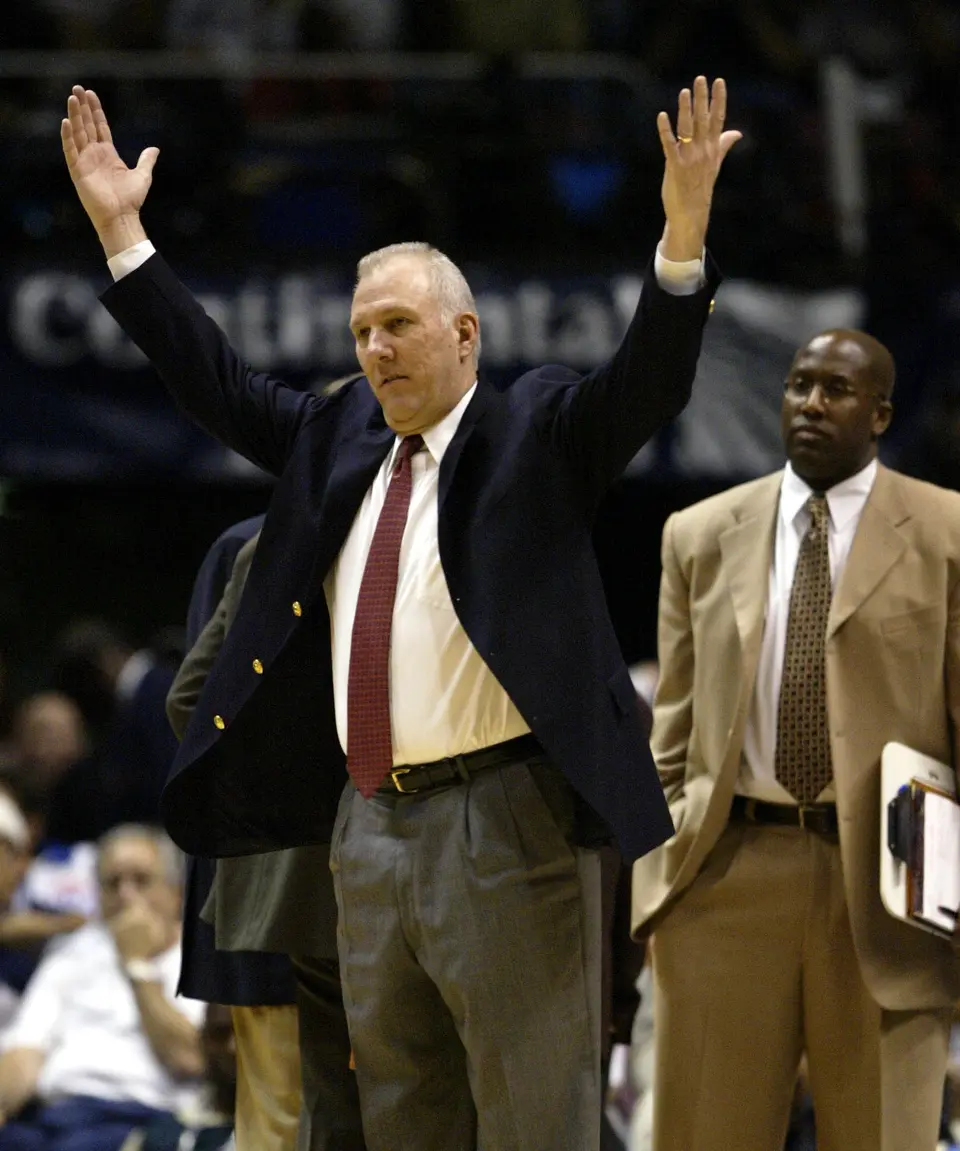 ORG XMIT: S0406155559 San Antonio Spurs' Gregg Popovich gestures in the second half against the New Jersey Nets during Game 5 of the NBA Finals Friday, June 13, 2003 in East Rutherford, NJ. At right is Spurs assistant coach Mike Brown. (AP Photo/Rusty Kennedy) ERA119 06152003xSPORTS2