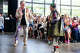 Sunny Smith walks the runway with artist Joe Spears during Beyond Trend.
