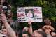 People protest outside the police station in Southampton, England, on Tuesday, June 2, 2026, one holding a photo of December 2025 stabbing victim Henry Nowak, 18. (Gareth Fuller/PA via AP)