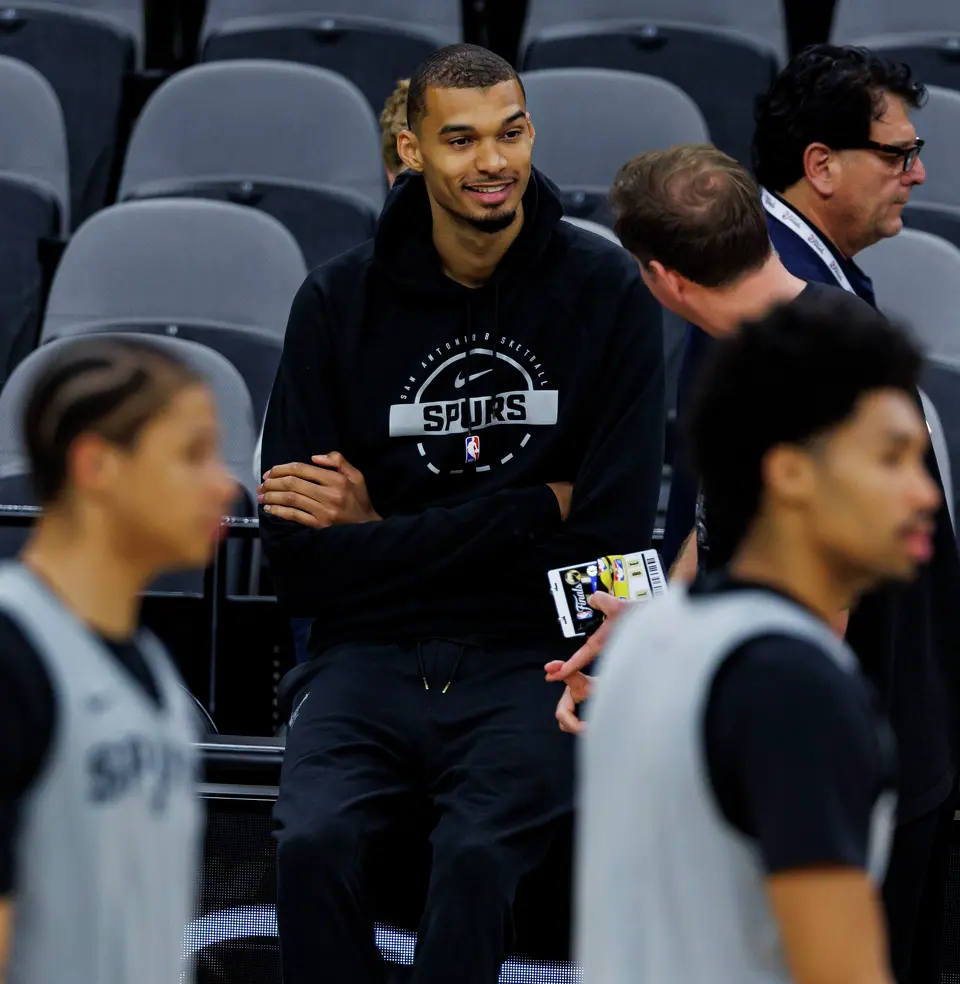 San Antonio Spurs center Victor Wembanyama, left, talks to Peter J. Holt, the managing partner and chairman of Spurs Sports & Entertainment, during practice at Frost Bank Center in San Antonio, Tuesday, June 2, 2026, ahead of the NBA Finals series against the New York Knicks.