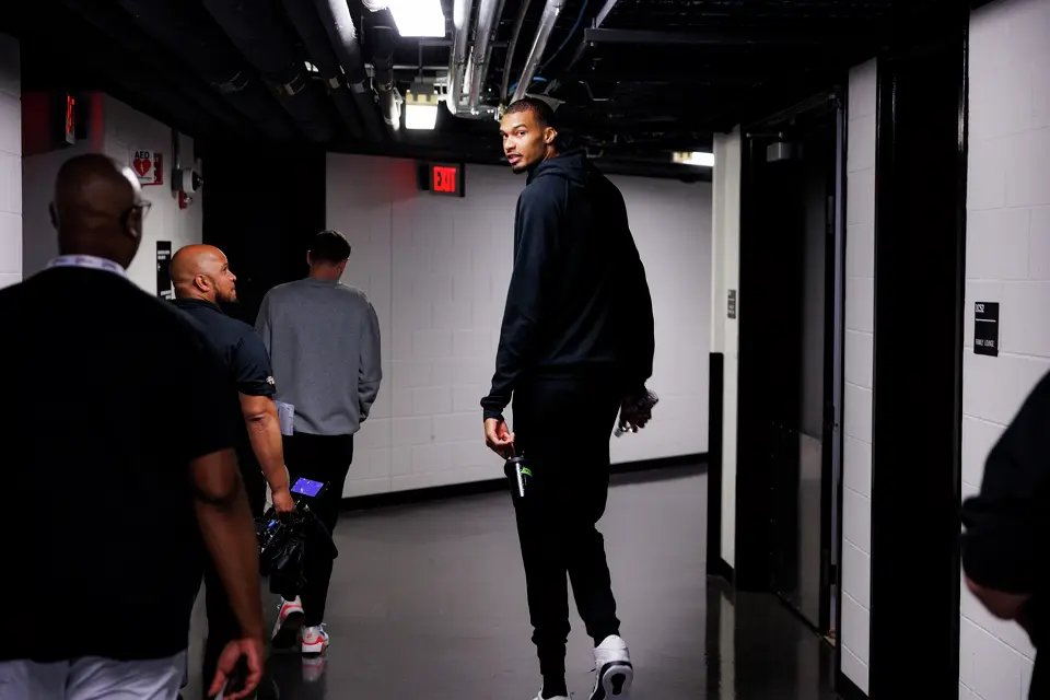 San Antonio Spurs center Victor Wembanyama, left, walks down a hallway at Frost Bank Center in San Antonio, Tuesday, June 2, 2026, following a team practice and media interviews as his team prepares to take on the New York Knicks in the NBA Finals.