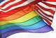 FILE - An LGBTQ+ pride flag flies beneath a U.S. flag at the Stonewall National Monument in New York, on Oct. 11, 2017.