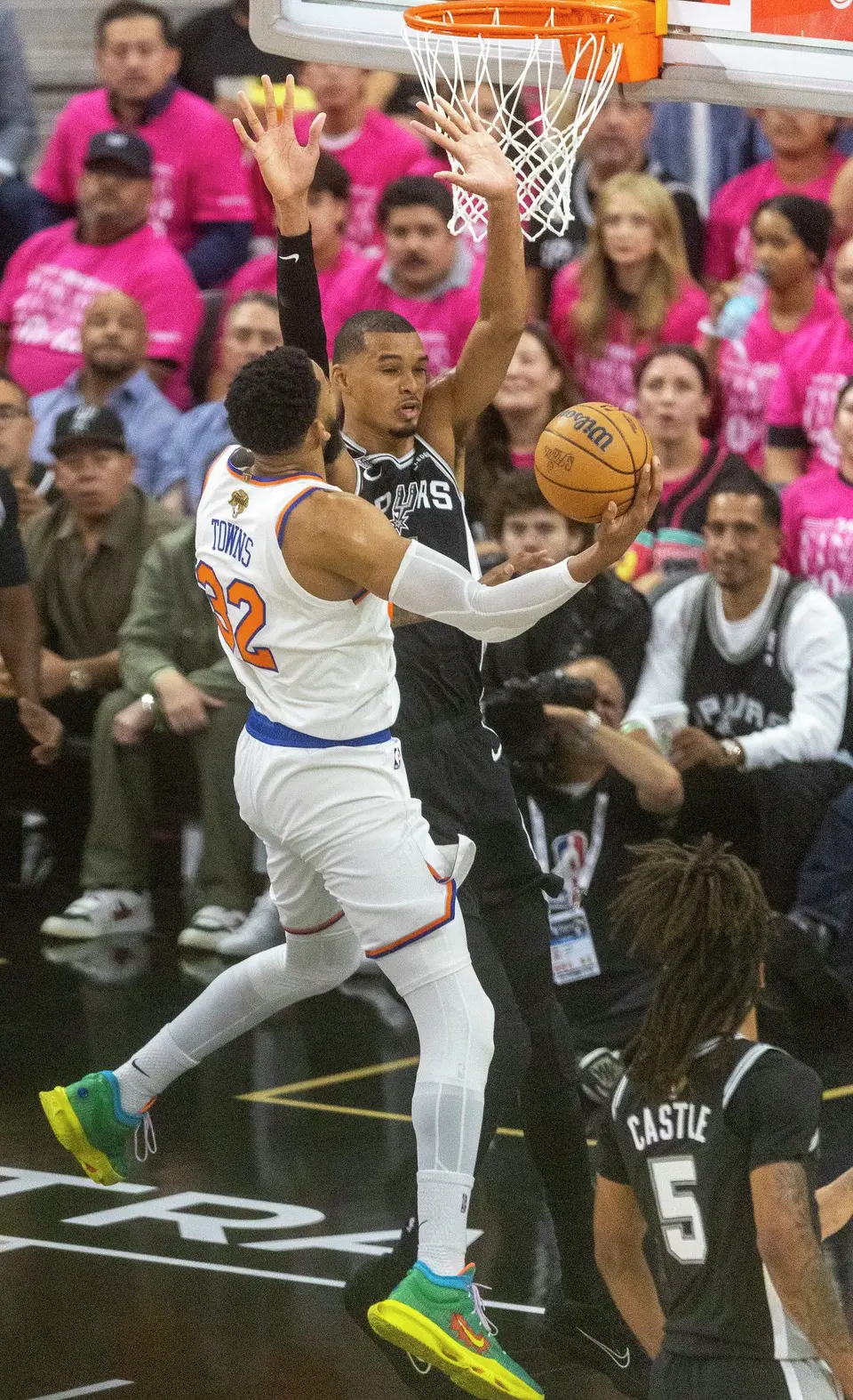 New York Knicks center Karl-Anthony Towns (32) shoots the ball guarded by San Antonio Spurs center Victor Wembanyama (1) during Game 1 of the NBA Finals at Frost Bank Center in San Antonio, Wednesday, June 3, 2026.