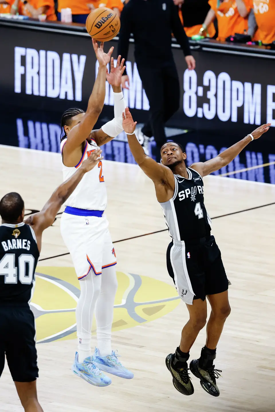 San Antonio Spurs guard De'Aaron Fox (4) reaches to try to block the ball during the first quarter Game 1 of the NBA Finals at Frost Bank Center in San Antonio, on Wednesday, June 3, 2026.