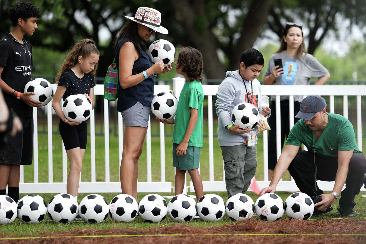Youth soccer players, players and families gather to attempt to set and official Guinness World Record for the longest continuous line of soccer balls, Saturday, April 11, 2026.