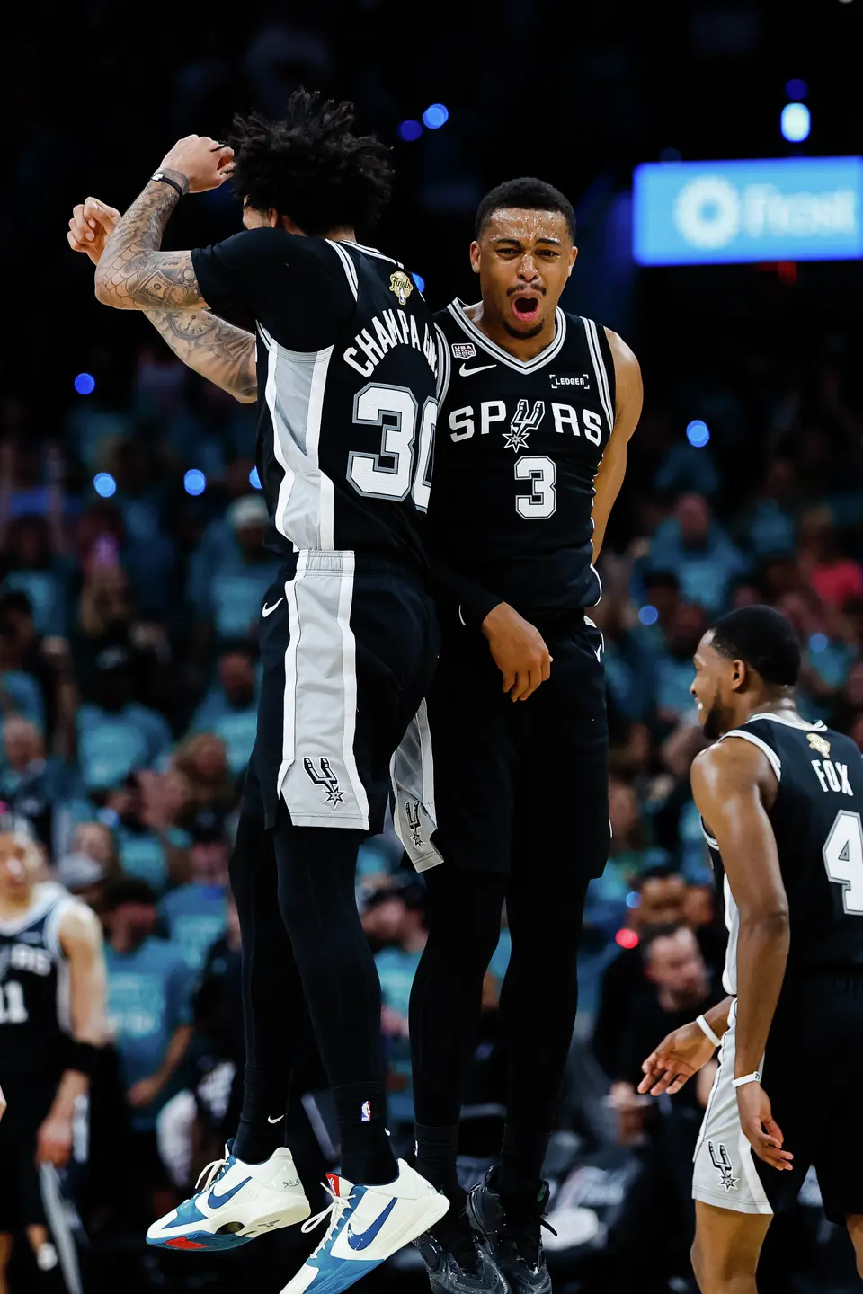 San Antonio Spurs forward Julian Champagnie (30) and Spurs forward Keldon Johnson (3) celebrate a play during Game 1 of the NBA Finals against the New York Knicks at Frost Bank Center in San Antonio, on Wednesday, June 3, 2026.