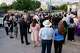 People observe a moment of silence during a vigil for victims of The Clyde apartment explosion and fire in Oak Cliff on Wednesday, June 3, 2026, in Dallas.