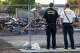 Dallas Fire-Rescue firefighters look over debris at the site of a deadly explosion and fire at The Clyde apartment building in Oak Cliff on Wednesday, June 3, 2026, in Dallas.