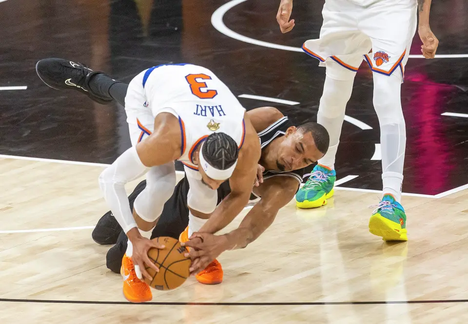 San Antonio Spurs center Victor Wembanyama (1) and New York Knicks guard Josh Hart (3) fight for a lose ball during Game 1 of the NBA Finals at Frost Bank Center in San Antonio, Wednesday, June 3, 2026.
