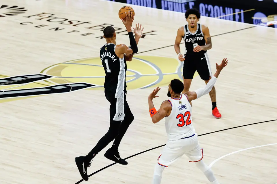 San Antonio Spurs center Victor Wembanyama (1) goes to pass the ball during Game 1 of the NBA Finals against the New York Knicks at Frost Bank Center in San Antonio, on Wednesday, June 3, 2026.