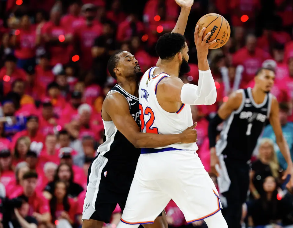 San Antonio Spurs forward Harrison Barnes (40) guards New York Knicks center Karl-Anthony Towns (32) during Game 1 of the NBA Finals at Frost Bank Center in San Antonio, on Wednesday, June 3, 2026.