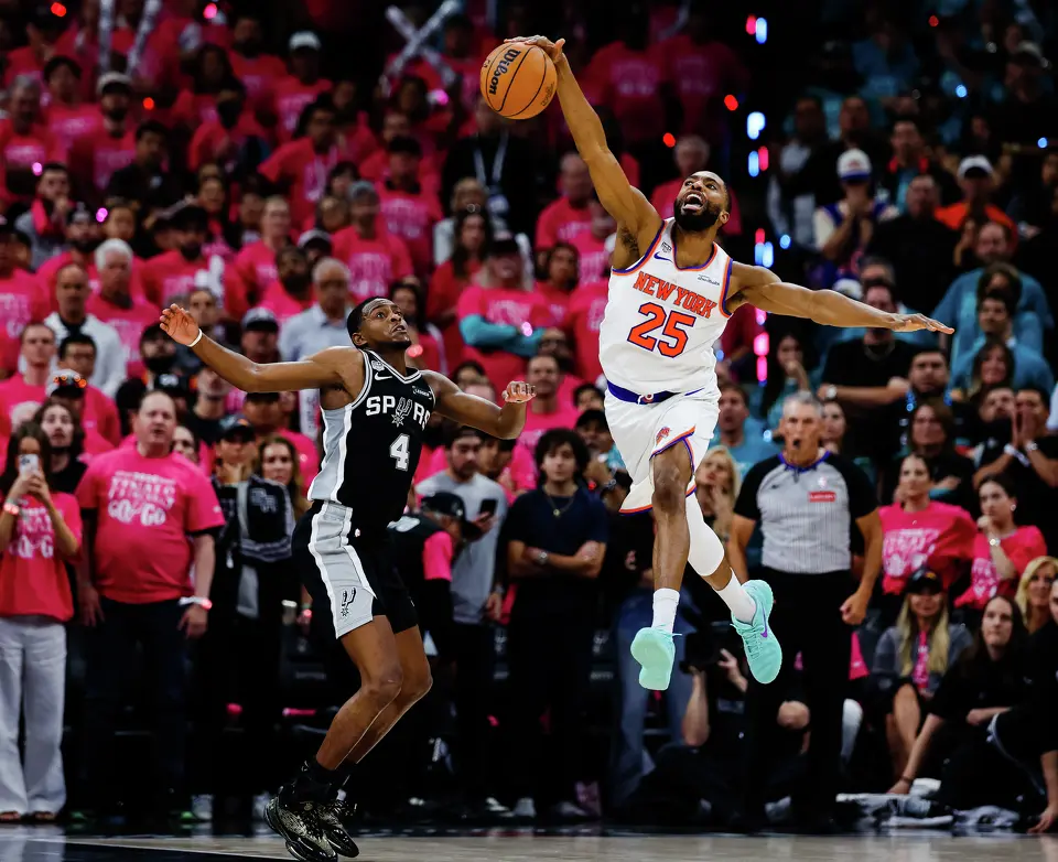 New York Knicks guard Mikal Bridges (25) bounces the ball after getting fouled by San Antonio Spurs guard De'Aaron Fox (4) during Game 1 of the NBA Finals at Frost Bank Center in San Antonio, on Wednesday, June 3, 2026.