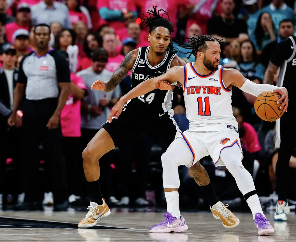 San Antonio Spurs guard Devin Vassell (24) defends New York Knicks guard Jalen Brunson (11) during Game 1 of the NBA Finals at Frost Bank Center in San Antonio, on Wednesday, June 3, 2026.