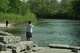 People fish along the Maquoketa River, Thursday, May 7, 2026, in Manchester, Iowa.