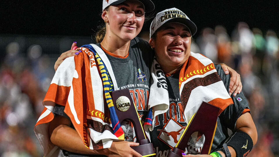 Texas Longhorns pitcher Teagan Kavan (17) and infielder Katie Stewart (20) hug after winning game two of the NCAA Women’s College World Series against Texas Tech at Devon Park on Thursday, June 4, 2026 in Oklahoma City, Oklahoma.