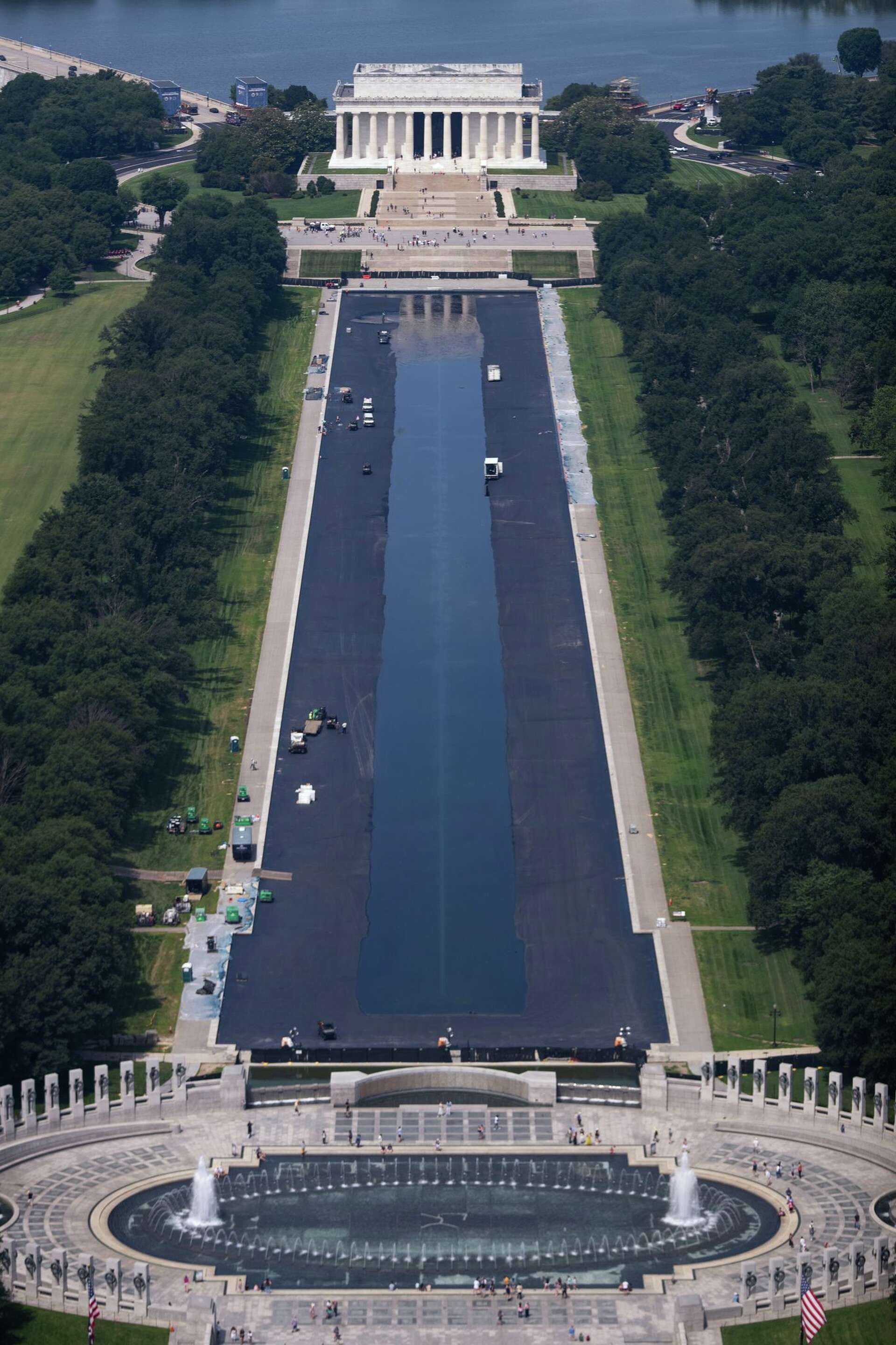 Reflection Pool Contractor Refilling starts for newly painted Reflecting Pool in Washington, in photos
