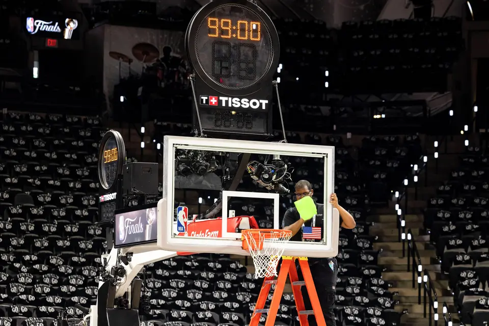 The backboard of the hoop is wiped down prior to the start of Game 2 of the NBA Finals at Frost Bank Center in San Antonio on Friday, June 5, 2026.