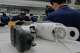 Workers assemble robot legs components at the LY iTech Beijing Super Factory for Embodied Artificial Intelligence during a media tour in the Beijing E-Town on the outskirts of Beijing on May 29, 2026.