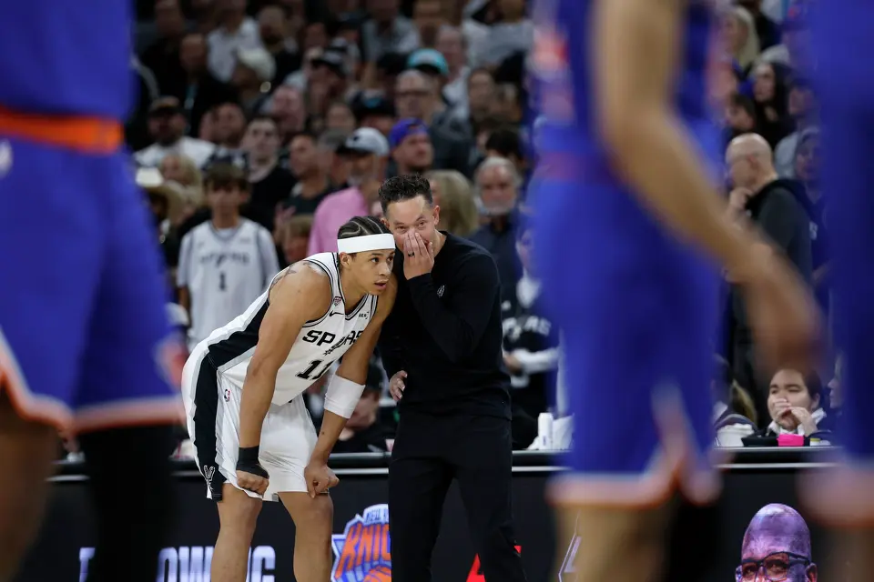 San Antonio Spurs head coach Mitch Johnson gives instructions to San Antonio Spurs forward Carter Bryant (11) during the first quarter of Game 2 of the NBA Championship at Frost Bank Center in San Antonio on Friday, June 5, 2026.