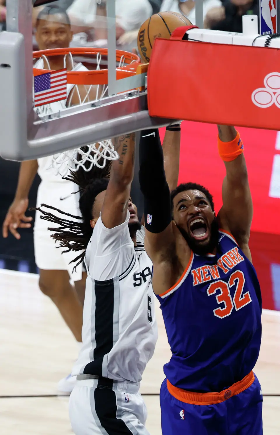New York Knicks center Karl-Anthony Towns (32) tries for a layup past San Antonio Spurs guard Stephon Castle (5) during the second quarter of Game 2 of the NBA Championship at Frost Bank Center in San Antonio on Friday, June 5, 2026.