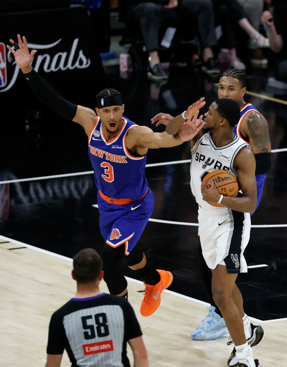 New York Knicks guard Josh Hart (3) reacts to a foul on San Antonio Spurs forward Keldon Johnson (3) during the second quarter of Game 2 of the NBA Championship at Frost Bank Center in San Antonio on Friday, June 5, 2026.