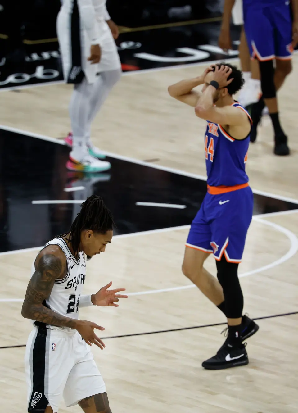 San Antonio Spurs guard Devin Vassell (24) makes the three point shot to the dismay of New York Knicks guard Landry Shamet (44 during the second quarter of Game 2 of the NBA Championship at Frost Bank Center in San Antonio on Friday, June 5, 2026.