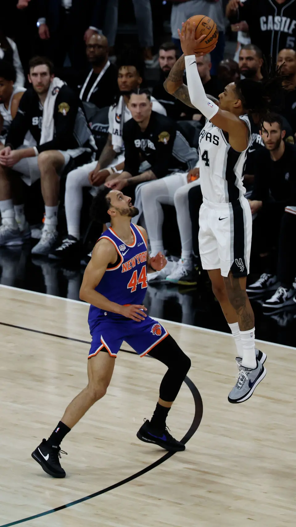 San Antonio Spurs guard De'Aaron Fox (4) takes the three point shot over New York Knicks guard Landry Shamet (44) during the second quarter of Game 2 of the NBA Championship at Frost Bank Center in San Antonio on Friday, June 5, 2026.