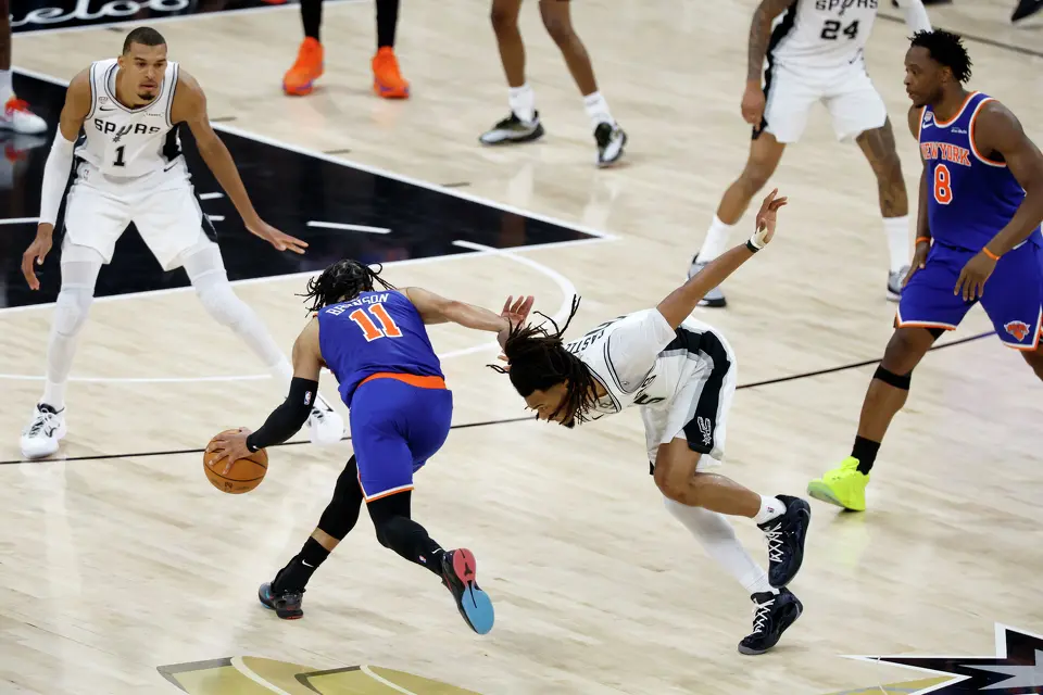 New York Knicks guard Jalen Brunson (11) gets past San Antonio Spurs guard Stephon Castle (5) during the fourth quarter of Game 2 of the NBA Championship at Frost Bank Center in San Antonio on Friday, June 5, 2026. The Knicks beat the Spurs 105 to 104 to take a 2-0 lead.