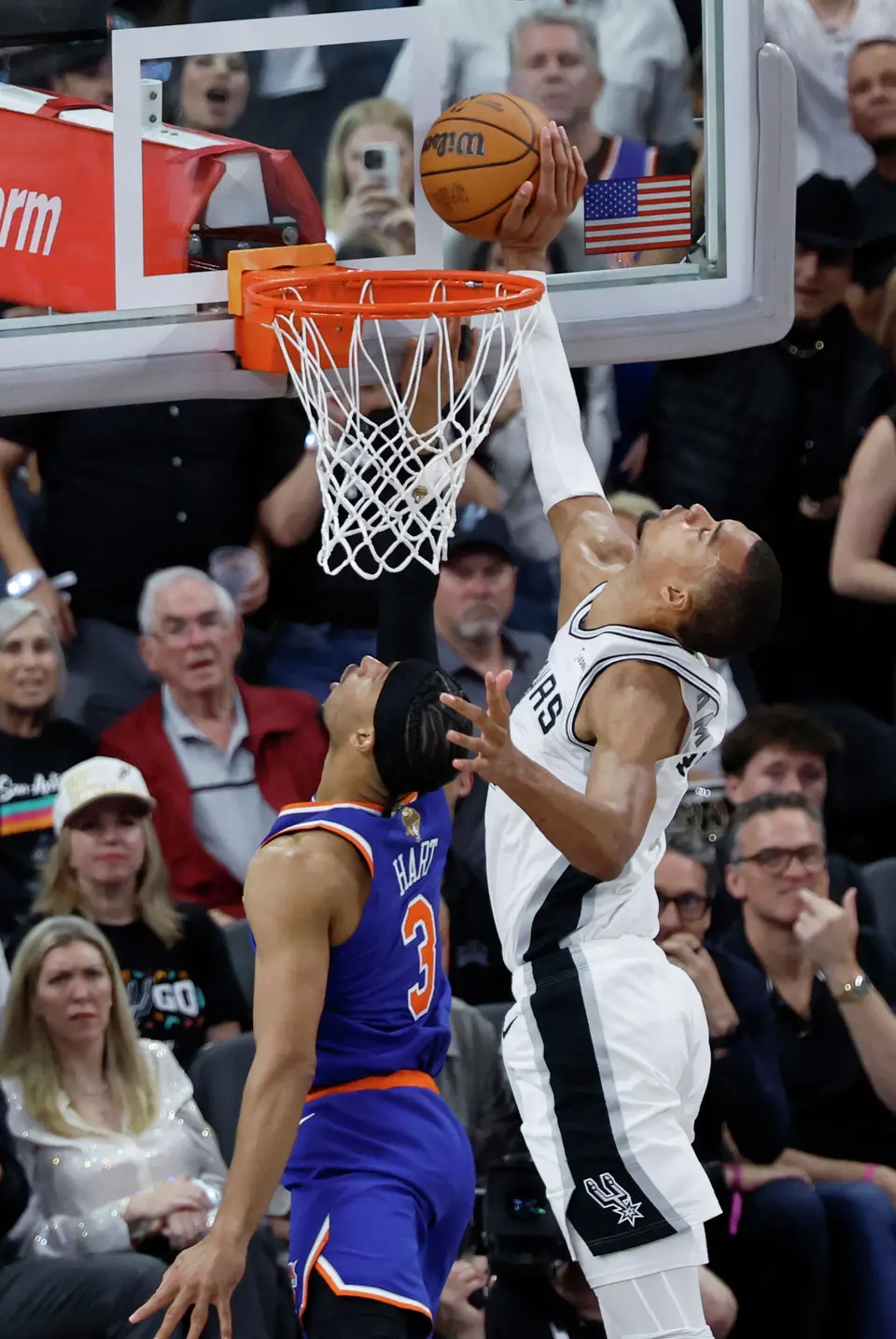 San Antonio Spurs center Victor Wembanyama (1) blocks a layup by New York Knicks guard Josh Hart (3) during the fourth quarter of Game 2 of the NBA Championship at Frost Bank Center in San Antonio on Friday, June 5, 2026. The Knicks beat the Spurs 105 to 104 to take a 2-0 lead.