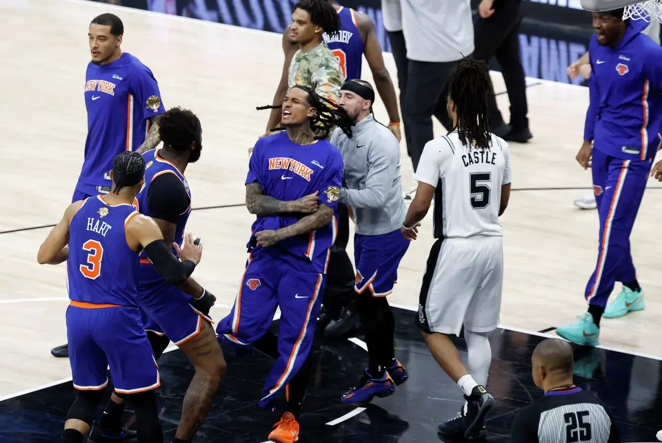 The New York Knicks storm the floor at the end of Friday’s game at Frost Bank Center after beating the San Antonio Spurs 105 to 104 to take a 2-0 lead in the series.