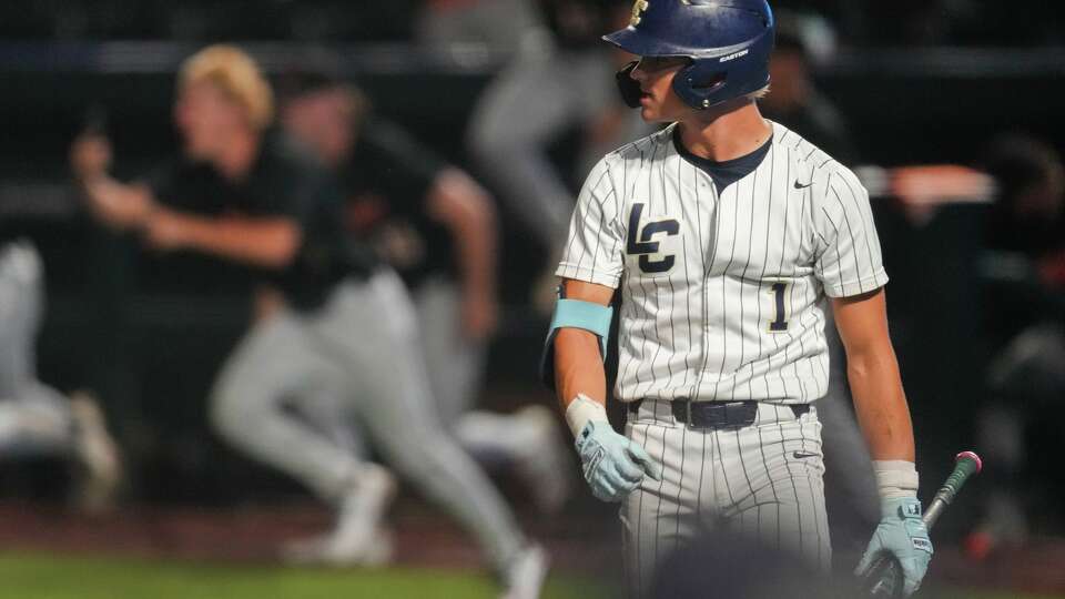 Lake Creek's Reed Newkirk watches Aledo celebrate after striking out for the final out of the Class 5A, Division I championship at Dell Diamond in Round Rock, Friday, June 5, 2026. Aledo defeated Lake Creek 3-1.