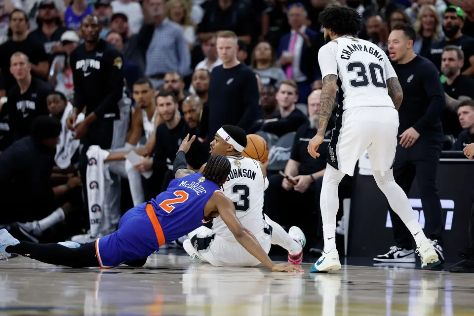 San Antonio Spurs forward Keldon Johnson (3) grabs a loose ball away from New York Knicks guard Miles McBride (2) during the third quarter of Game 2 of the NBA Championship at Frost Bank Center in San Antonio on Friday, June 5, 2026.