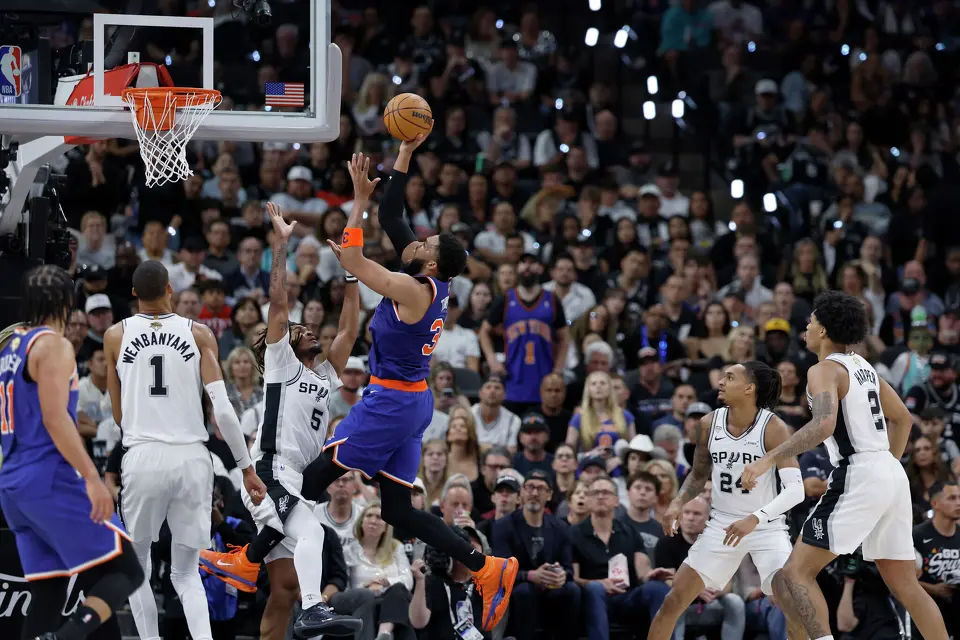 New York Knicks guard Josh Hart (3) takes a jump shot over San Antonio Spurs guard Stephon Castle (5)during the third quarter of Game 2 of the NBA Championship at Frost Bank Center in San Antonio on Friday, June 5, 2026.