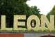 Visitors pose for photos next to a sign bearing the name of Pope Leo XIV in Madrid, Spain, Saturday, June 6, 2026.