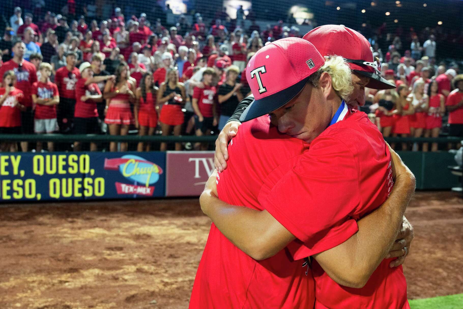 Tomball’s Nolan Rush, right, embraces his dad and head coach Doug Rush after defeating Memorial 9-1 to win the Class 6A, Division II championship at Dell Diamond in Round Rock, Saturday, June 6, 2026.
