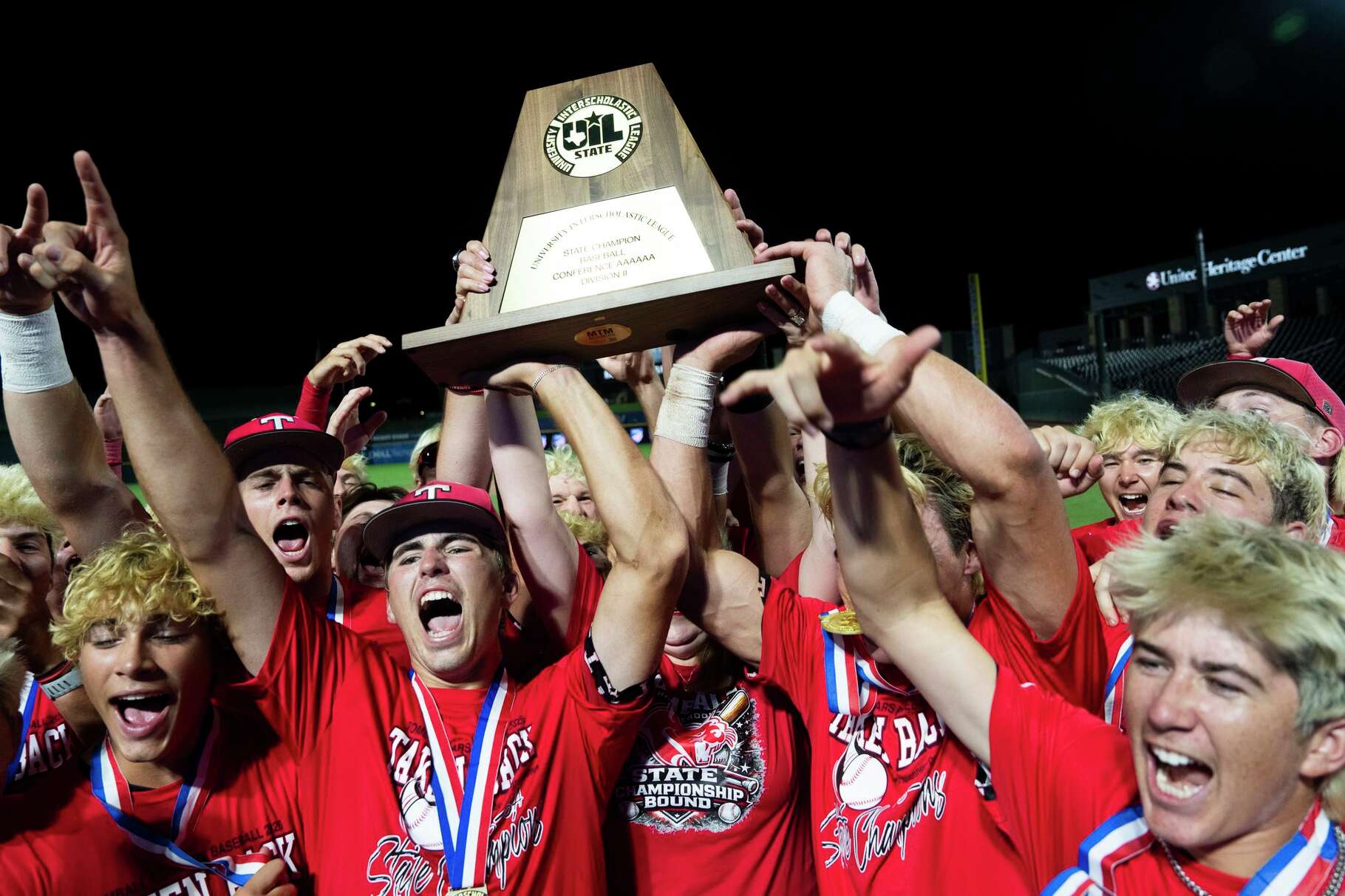 Tomball players celebrate after defeating Memorial 9-1 to win the Class 6A, Division II championship at Dell Diamond in Round Rock, Saturday, June 6, 2026.