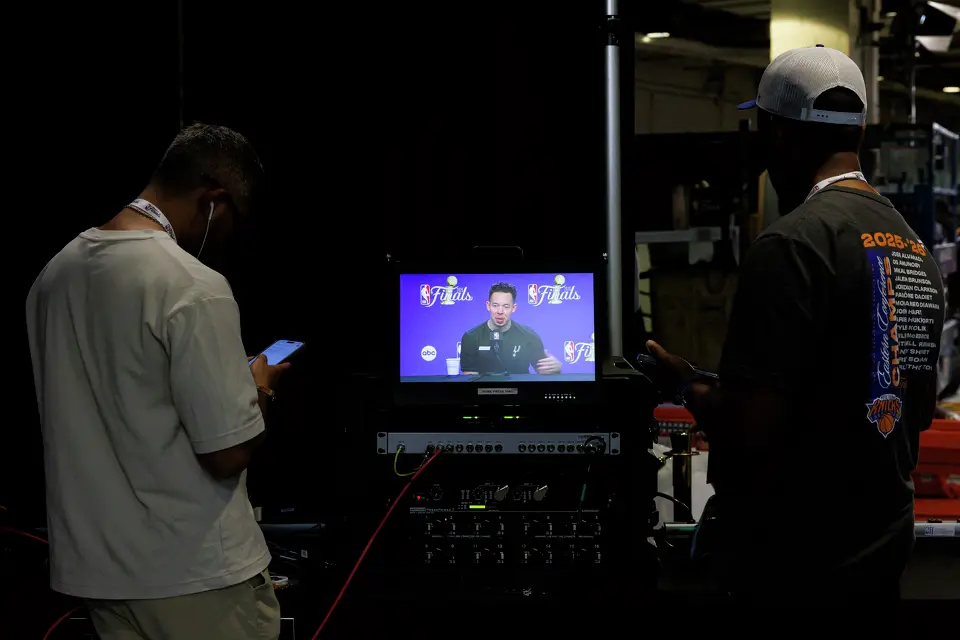 Reporters watch a screen displaying San Antonio Spurs head coach Mitch Johnson’s news conference at Madison Square Garden in New York, Sunday, June 7, 2026, ahead of Game 3 of the NBA Finals against the New York Knicks.