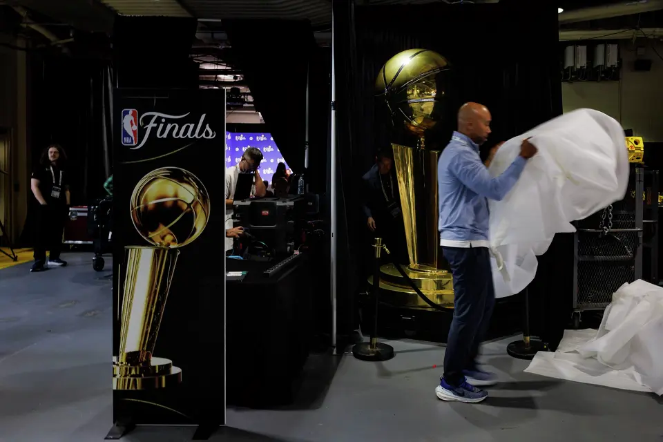 Workers unbox a giant replica of the Larry O'Brien Championship Trophy at Madison Square Garden in New York, Sunday, June 7, 2026, ahead of Game 3 of the NBA Finals against the New York Knicks.