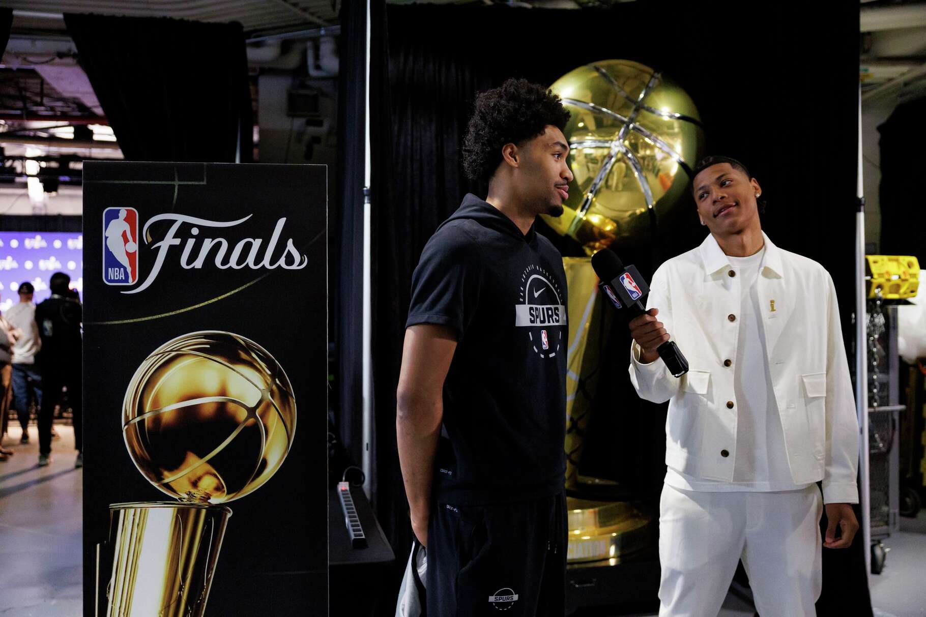 San Antonio Spurs guard Dylan Harper, left, does an interview before heading to the court for practice at Madison Square Garden in New York, Sunday, June 7, 2026, ahead of Game 3 of the NBA Finals against the New York Knicks.