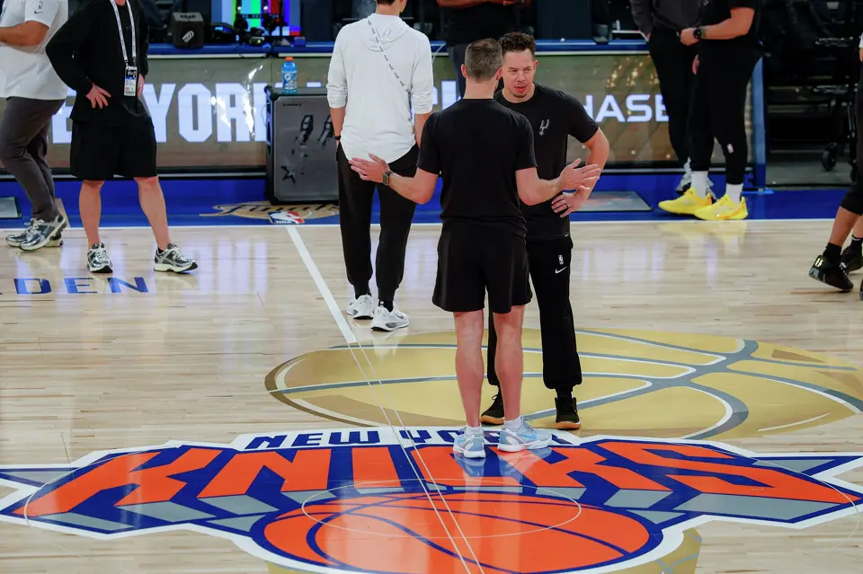 San Antonio Spurs head coach Mitch Johnson, right, talks to a member of his coaching staff as they stand on the NBA Finals court logo during practice at Madison Square Garden in New York, Sunday, June 7, 2026, ahead of Game 3 of the NBA Finals against the New York Knicks.