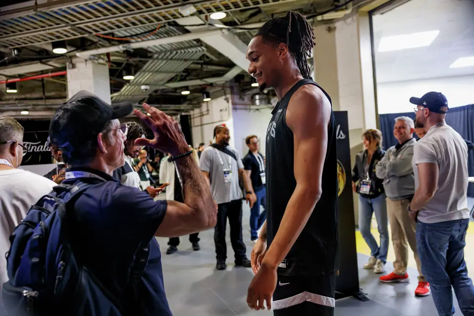 Ben Stiller, left, introduces himself to San Antonio Spurs guard Devin Vassell, center, after a news conference at Madison Square Garden in New York, Sunday, June 7, 2026, ahead of Game 3 of the NBA Finals against the New York Knicks.