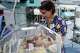 Nurse Victoria Bohdanova changes the diaper of a premature baby inside a temperature-controlled incubator at the regional perinatal center of Zaporizhzhia, Ukraine, Wednesday, May 6, 2026.