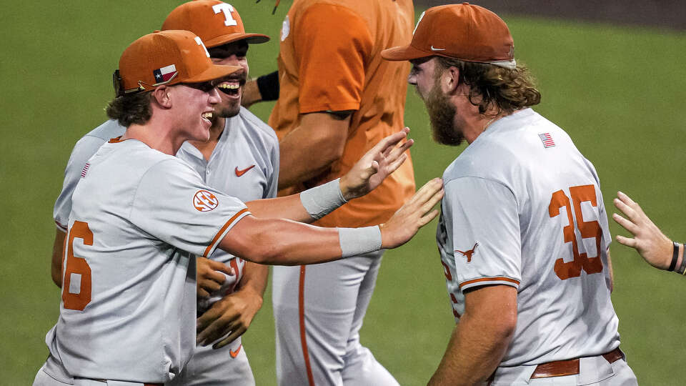 From left, Texas Longhorns infielder Callum Early (36), pitcher Ruger Riojas (13) and pitcher Sam Cozart (35) celebrates winning game two of the NCAA Baseball Super Regional against Oregon at UFCU Disch-Falk Field on Sunday, June 7, 2026 in Austin.