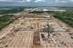 Construction work on the Optimus factory near Tesla’s Gigafactory Texas is seen on Monday, outside Austin. Tesla says the site will support production of future versions of its humanoid robot as the company expands its robotics ambitions.